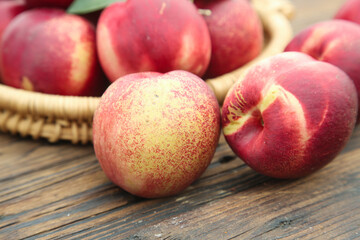 Fresh White Flesh Nectarines in Wicker Basket on Wooden Table - Organic Stone Fruit Display