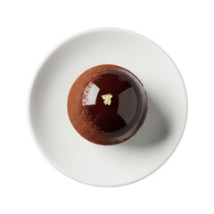 A spherical, glossy dark chocolate truffle with cocoa dust and gold leaf on white porcelain plate, top-down on transparent, soft studio light, gourmet chocolate luxury concept