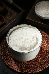 Fragrant Long Grain White Rice in Traditional Ceramic Bowl on Bamboo Placemat Asian Kitchen Setup
