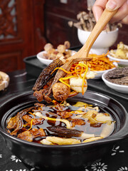 Golden morel mushroom hot pot with bamboo shoots and traditional Chinese soup ingredients