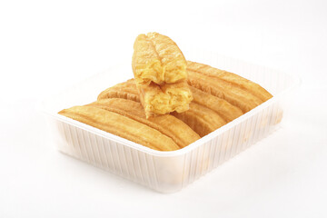 Golden Fried Dough Sticks Churros in Plastic Container Traditional Deep Fried Pastry Snacks