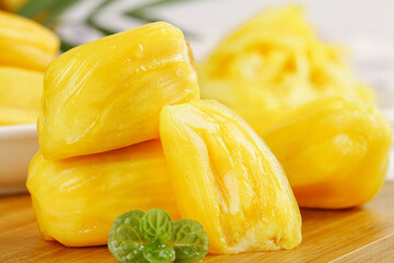 Fresh Cut Pineapple Chunks with Golden Yellow Flesh on Wooden Board