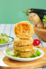 Deep Fried Eggplant Cake Slices Stacked on Plate - Traditional Chinese Cuisine Food Photography