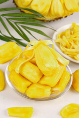 Fresh Thai Honey Pineapple Slices and Chunks in Glass Bowls with Palm Leaves