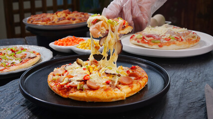 Delicious Italian Pizza Slice with Melted Cheese Being Lifted Showing Stretchy Mozzarella Strings