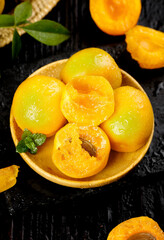 Fresh Picked Apricots and Plums in Wooden Bowl - Dunhuang Natural Stone Fruits Ripening on Dark Background