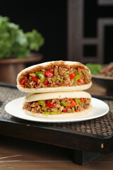 Handmade Tongguan Meat Buns from Shaanxi Province - Traditional Chinese Street Food on White Plate