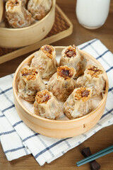 Siu Mai Dim Sum Dumplings with Pork Rice and Shiitake Mushrooms in Bamboo Steamer