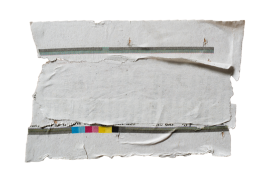 Pieces of torn newspaper glued together to create a grey rectangular textbox