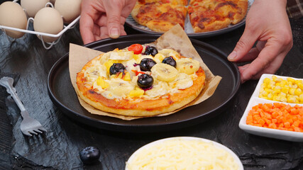 Chef Making Fresh Italian Pizza with Cheese and Toppings in Kitchen Cooking Demonstration