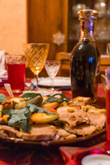 Delicious roasted duck with crispy golden skin and baked potatoes served in a tray fresh out of the oven. 