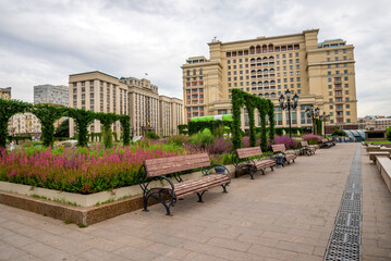 Charming Artistic Garden at Historic Manege Square with Luxury Four Seasons Hotel and State Parliament Building in the Background, Moscow, Russia, 9 August 2025