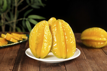 Fresh Sliced Star Fruit on White Plate with Tropical Kitchen Setting