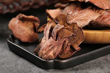 Dried Porcini Mushrooms on Black Plate - Nutritious Cooking Ingredients for Gourmet Recipes