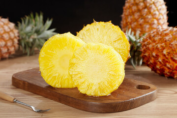 Fresh Golden Hainan Pineapple Slices with Sweet Diamond Flesh on Wooden Cutting Board - Premium Imported Tropical Fruit
