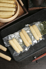 Sweet Sticky Corn Cobs Vacuum Packed in Traditional Bamboo Steamer - Asian Food Preparation