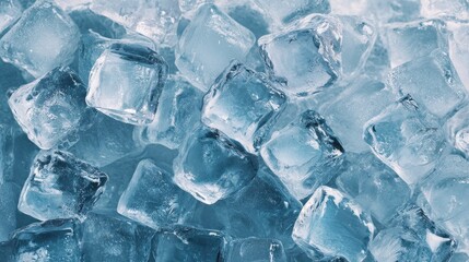 Clear blue ice cubes forming a refreshing frosty background texture.