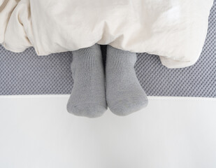 Sleeping in warm socks in cold winter