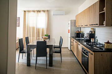 Stylish kitchen studio design in light tones