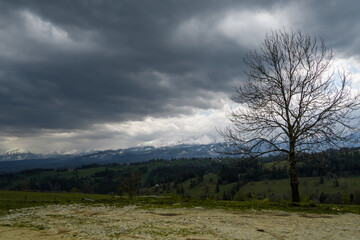 Dark dramatic clouds in the mountains, dangerous threatening weather