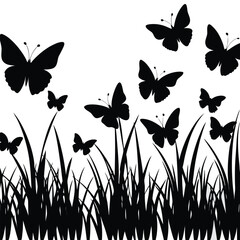 Silhouette of butterflies flying over grass