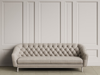 Tufted ivory color sofa in classic interior with copy space