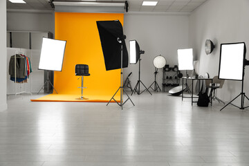 Interior of modern photo studio with professional equipment