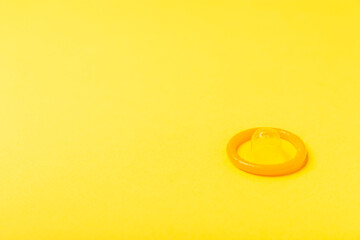 Condoms on a colored background. Colorful fruit-themed condoms in packaging. Safe sex concept. Contraceptive. Different birth control methods. Aids prevention. World AIDS Day. Sexual health.