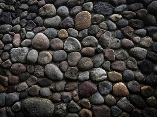 Rough Stone Wall Background with Various Sizes of Colorful Pebble Texture