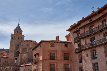 The medieval complex of Albarracin, Aragon, nestled in the rocky landscape, with its walls and reddish houses