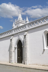 convent of Nossa Senhora da Conceiçã a White church tower with gothic detail and cross in Beja Portugal