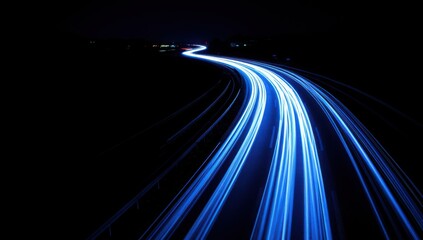 Highway with blue light trails on a black background