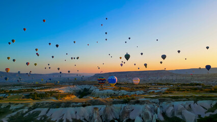 Spectacular Hot Air Balloons Soaring Over Cappadocia Valleys at Sunrise, Turkey