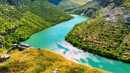 Spectacular Turquoise River Winding Through Lush Green Terraced Mountain Valley