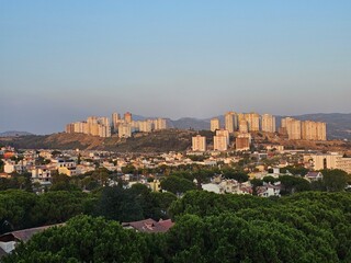 Fototapeta premium Picturesque view of Kusadasi city, turkey coast, Audin and mountain on horizon in mist, background for traveling and vacation, Beautiful sunny day.