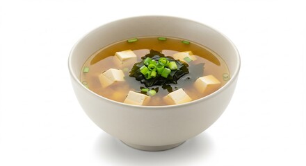 日本の伝統的な温かい味噌汁が白い陶器の器に丁寧に美しく盛られ純白の背景に際立つ ふっくら豆腐と磯の香り豊かなわかめ新鮮な青ネギが素材の質感を明るい光で鮮やかに輝かせ豊かな香りが広がり食欲をそそる. AI Generated