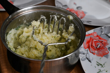 Stewed potatoes in a pot, dinner.
