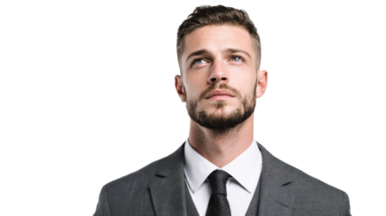 Confident man in a suit looking upwards, isolated on white background.