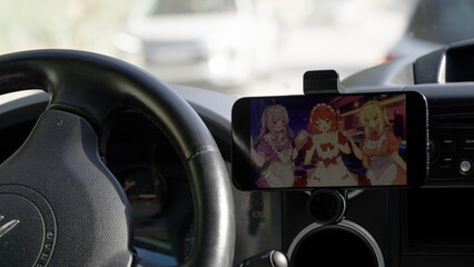 Watching anime tv series on smartphone while driving car stuck in traffic jam