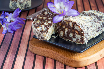 Sweet chocolate salami with nuts and biscuits