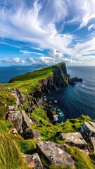 Dramatic coastal cliffs meet a turquoise sea under a vibrant sky