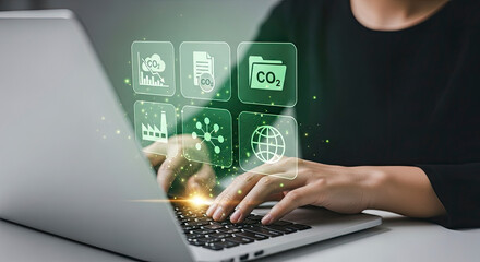 Business professional calculating carbon footprint and managing environmental data using a laptop with digital CO2 icons