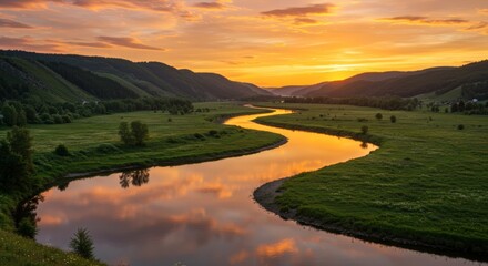 Scenic river winding through a green valley under a vibrant sunset sky with reflections and rolling hills