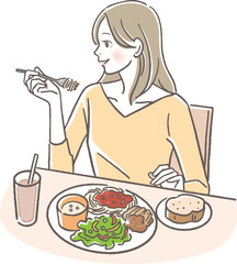 洋食を食べる女性