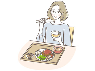 和食を食べる女性
