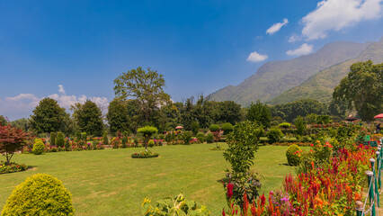 Stretching along the eastern banks of Dal Lake, Nishat Bagh-terraces of joy, where fountains sing and chinars guard the lake.