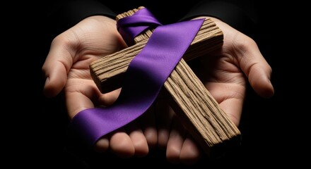 Hands Offering Wooden Cross Adorned with Purple Ribbon in Dark Setting