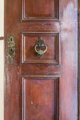 Antique wooden door with brass knocker in Murad I Hudavendigar Mausoleum, Bursa.