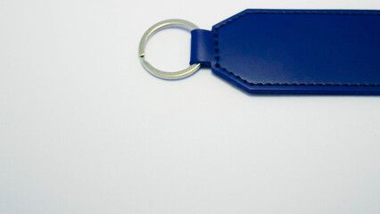 Set of colorful rectangular leather keychains with metal rings isolated on a white background. Concept of personalized accessories, engraving blanks, handmade crafts, and custom gift ideas