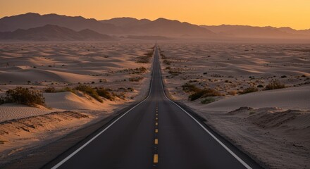 Fototapeta premium A long straight road stretches through a desert landscape at sunset with distant mountains and copy space